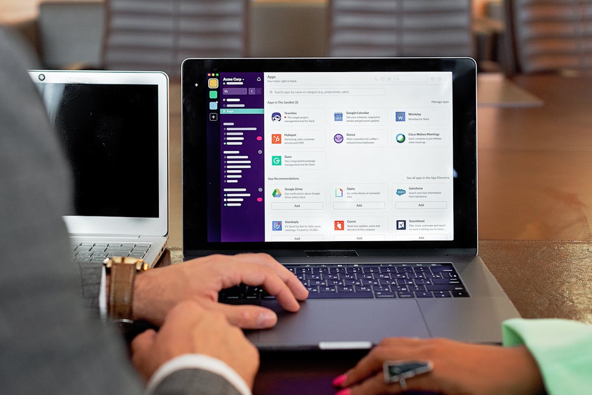 Business professional analyzing AI strategy on laptop