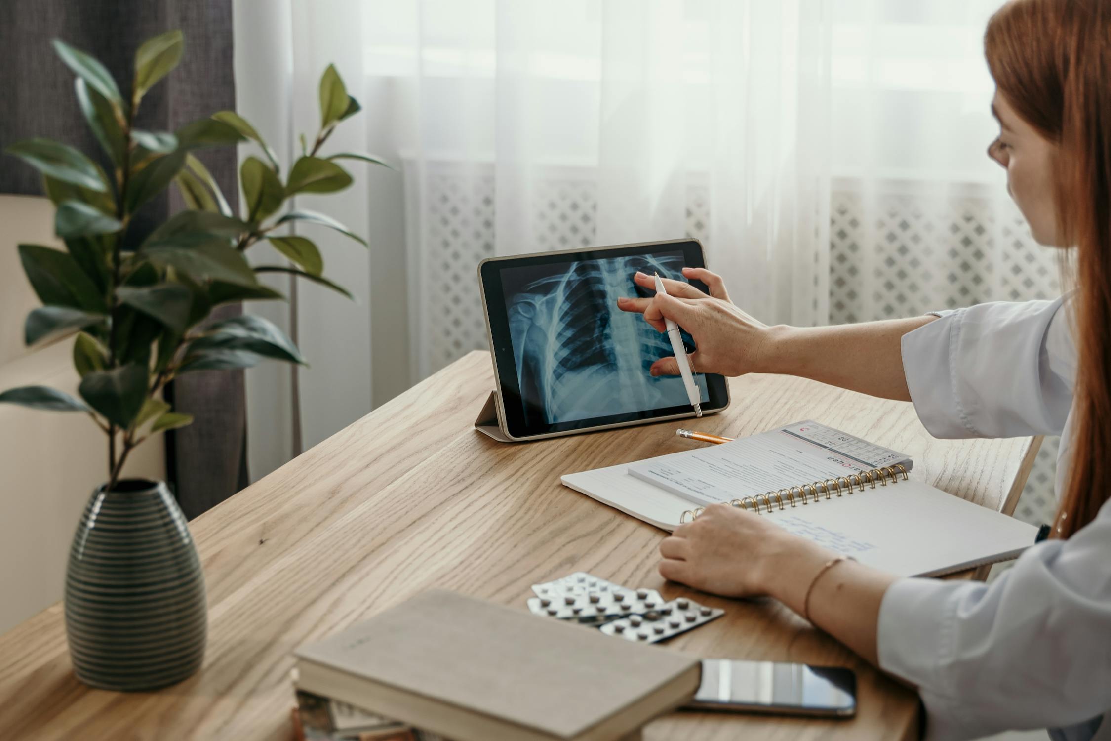 Healthcare professional reviewing digital practice workflow